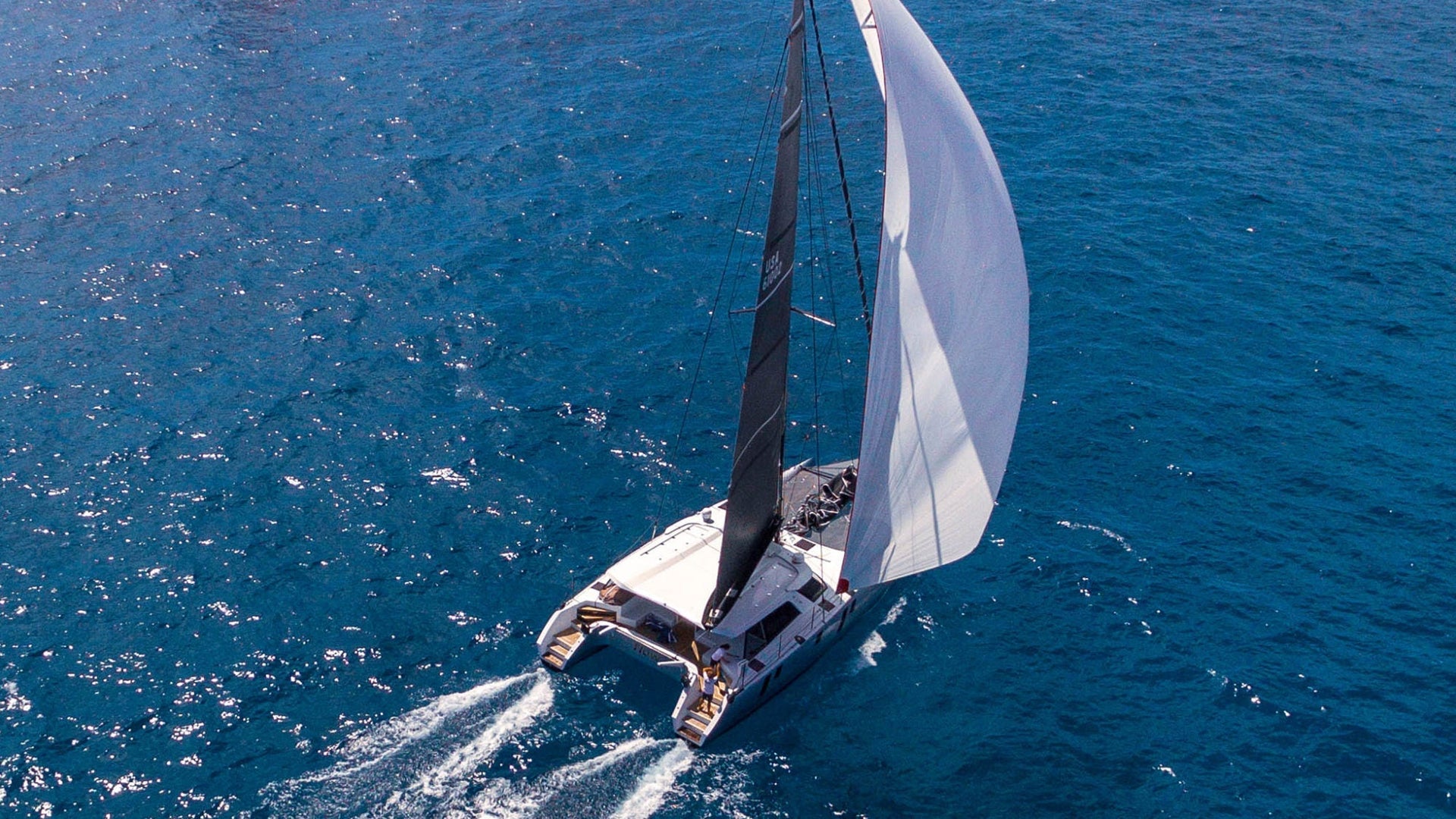MULTIHULL DOWNWIND SAIL DESIGNS, HANDLING OPTIONS AND TECHNIQUES